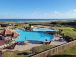 Balcony view of 2 pools  2-1/2 foot with waterfalls to the 3-foot pool. Open view to the Gulf  Make Coastal Calm, Port Aransas, your family vacation destination.